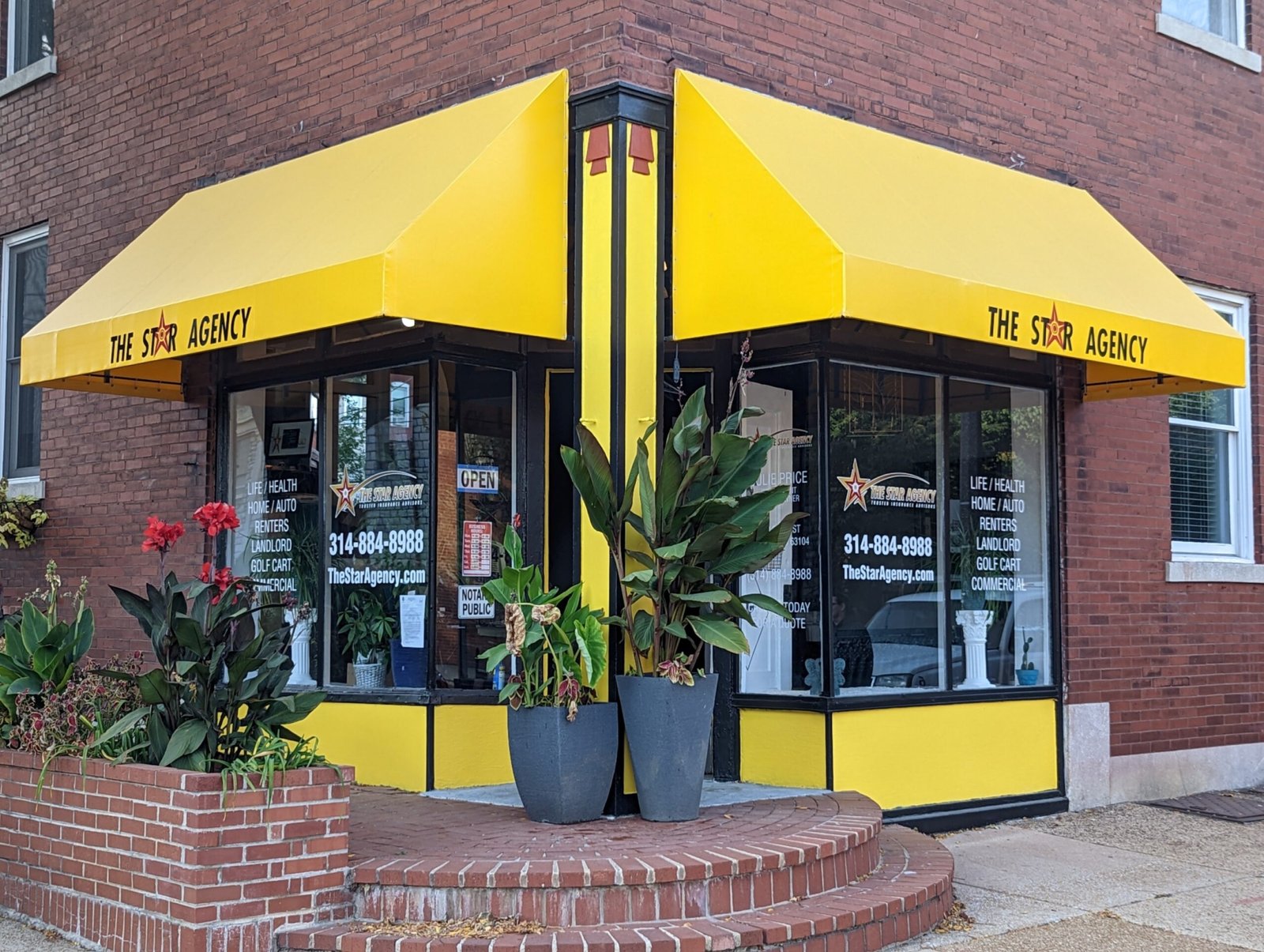 yellow stationary style awnings on a storefront